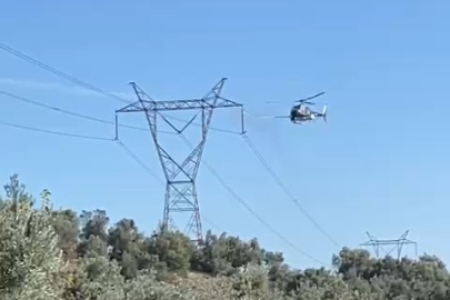 Yüksek gerilim hatları helikopterle temizlendi