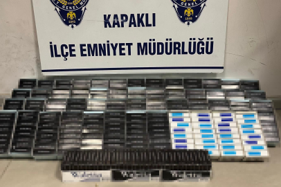 450 adet paketlenmiş sigara ve tabanca ele geçirildi   
