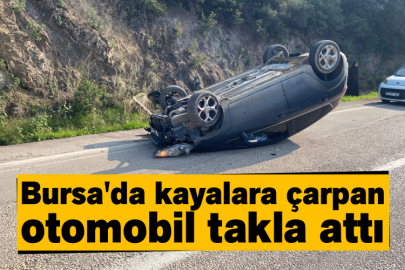 Bursa'da kayalara çarpan otomobil takla attı