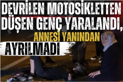 Devrilen motosikletten düşen genç yaralandı, annesi yanından ayrılmadı